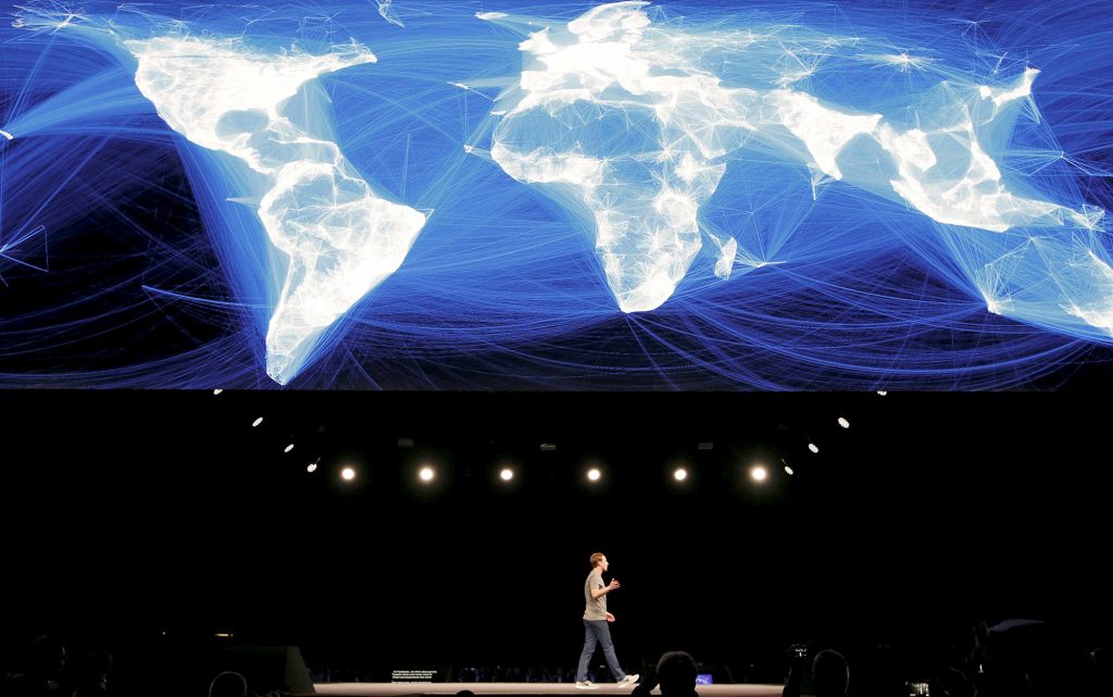 Mark Zuckerberg, founder of Facebook, speaks on the stage at the Mobile World Congress in Barcelona, Spain, February 2016. Photo by Albert Gea/Reuters
